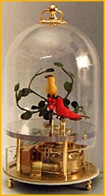 Oiseaux chanteurs m&eacute;caniques Oiseaux chanteurs m&eacute;caniques : 2 oiseaux chanteurs automates dans cage transparente