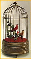 Oiseaux chanteurs m&eacute;caniques Oiseaux chanteurs m&eacute;caniques : 2 oiseaux chanteurs automates dans cage ancienne