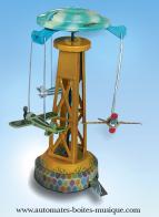 Jouets m&eacute;caniques en m&eacute;tal, t&ocirc;le et fer blanc Jouet m&eacute;canique en m&eacute;tal, t&ocirc;le et fer blanc : jouet m&eacute;canique man&egrave;ge avec avions
