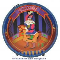 Tirelires musicales anim&eacute;es Tirelire musicale anim&eacute;e : tielire musicale anim&eacute;e en bois avec clown sur un cheval