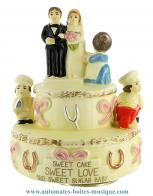 Bo&icirc;tes &agrave; musique pour mariages Bo&icirc;te &agrave; musique humoristique en r&eacute;sine sur le th&egrave;me du mariage : bo&icirc;te &agrave; musique Trousselier avec g&acirc;teau des mari&eacute;s