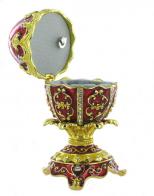 Oeufs musicaux en métal de style Fabergé Oeuf musical de style Fabergé en métal: oeuf musical rouge avec dorures, strass et 4 pieds