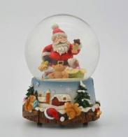 Boules à neige musicales de Noël disponibles sur commande (nous contacter) Boule à neige musicale de Noël avec globe en verre, neige et Père Noël avec un petit chien