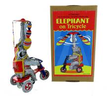 Jouets mécaniques en métal, tôle ou fer blanc Jouet mécanique en métal, tôle et fer blanc: jouet mécanique éléphant sur tricycle