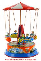 Jouets mécaniques en métal, tôle ou fer blanc non disponibles Jouet mécanique en métal, tôle et fer blanc agrafé : jouet mécanique "Manège avec navettes"