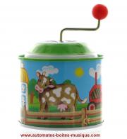 Boîtes à musique à manivelle en métal Boîte à musique à manivelle en métal en forme de moulin à musique : boîte avec vache et animaux de la ferme