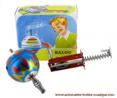 Jouets mécaniques en métal, tôle ou fer blanc Jouet mécanique en métal, tôle et fer blanc : toupie mécanique avec lanceur en métal