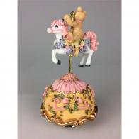 Chevaux de carrousel Cheval musical miniature en polystone : cheval automate musical rose tournant avec un ours sur son dos