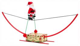 Automates musicaux de Noël (en stock) Automate musical de Noël Mr Christmas représentant un Père Noël faisant de l'équilibre sur un monocycle