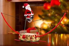 Automates musicaux de Noël (en stock) Automate musical de Noël Mr Christmas représentant un Père Noël faisant de l'équilibre sur un monocycle