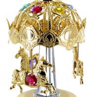 Boîtes à musique en cristal Swarovski Boîte à musique en métal doré et cristal Swarovski: Boîte à musique carrousel avec 9 cristaux Swarovski teintés