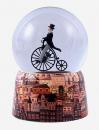 Boule à neige musicale animée avec globe en verre et base en porcelaine: boule à neige avec homme distingué sur un grand-bi