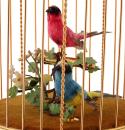 Automate de la maison Reuge avec deux oiseaux chanteurx mécaniques dans une cage dorée