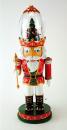 Automate musical de Noël en forme de casse-noisette avec scène de danseurs autour d'un sapin dans la couronne du personnage