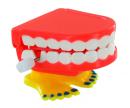 Petit automate m&eacute;canique en r&eacute;sine avec m&eacute;canisme &agrave; ressort - Dentier m&eacute;canique orange