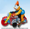 Jouet mécanique en métal, tôle et fer blanc : jouet mécanique clown sur moto