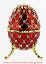 Oeuf musical de style Fabergé : oeuf musical rouge en métal avec strass et 3 pieds