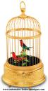 Automate oiseaux chanteurs mécaniques Reuge : 2 oiseaux chanteurs automates dans une cage à la finition dorée