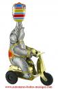 Jouet mécanique en métal, tôle et fer blanc agrafé : jouet mécanique "Eléphant sur tricycle"