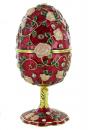 Oeuf musical de type Fabergé : oeuf musical rouge en métal avec dorures et strass