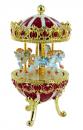 Oeuf musical de style Fabergé en métal : oeuf musical rouge avec chevaux de carrousel tournants